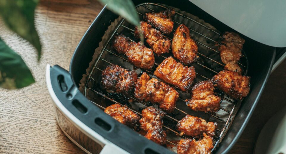 Delicious crispy chicken pieces cooked perfectly in a modern air fryer, ready to serve.