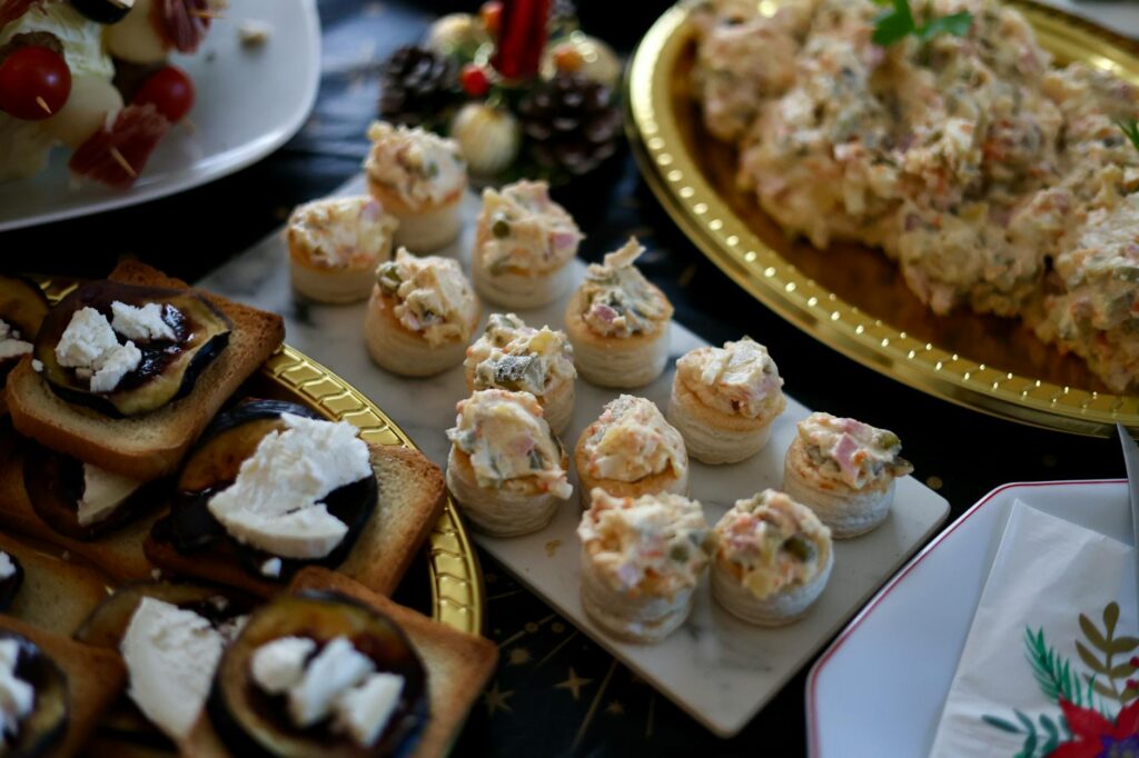 A beautifully arranged selection of canapés and hors d'oeuvres for a festive gathering.