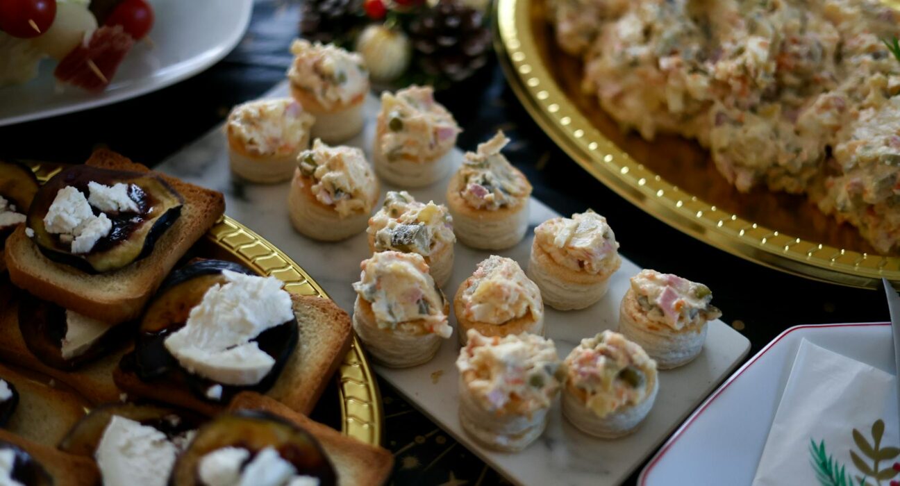 A beautifully arranged selection of canapés and hors d'oeuvres for a festive gathering.