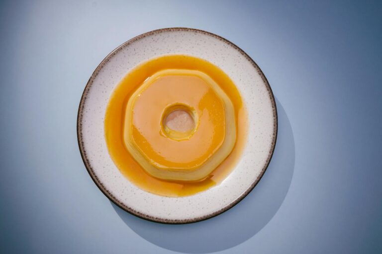 A delicious Brazilian flan on a white plate, perfect for food photography and culinary websites.