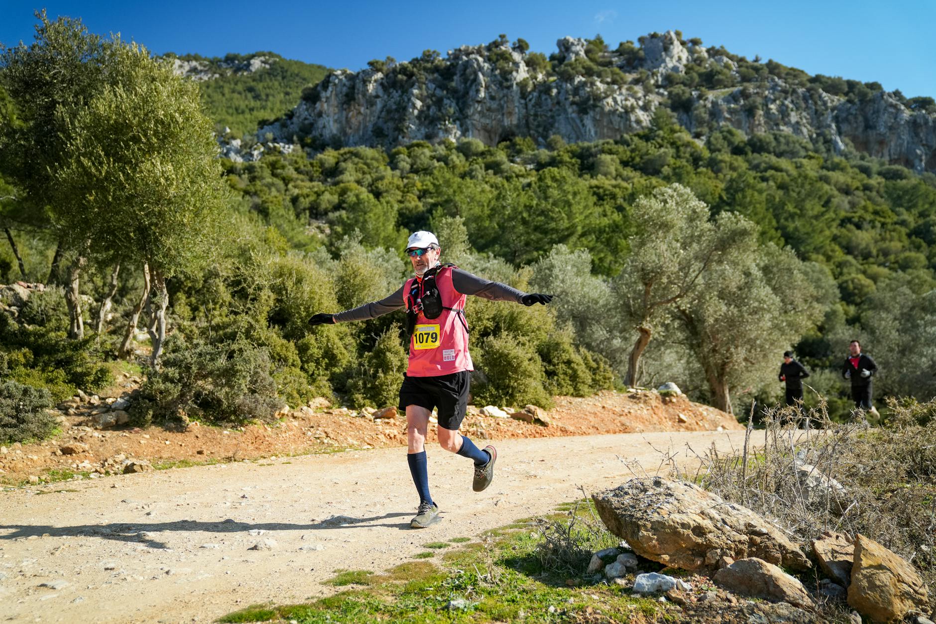 Energetic trail runner in scenic nature near İzmir, Türkiye, showcasing outdoor adventure.