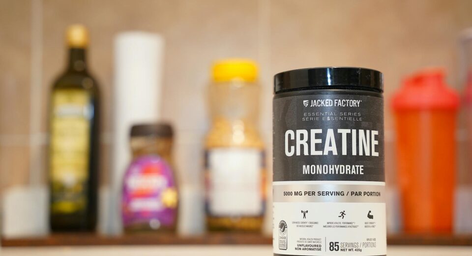 Creatine monohydrate from Jacked Factory displayed on a kitchen counter.