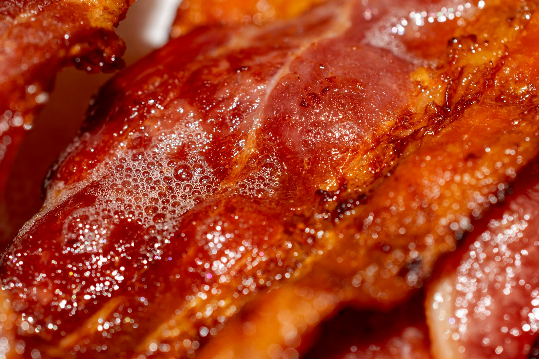 Close-up of delicious crispy bacon slices highlighting texture and color.